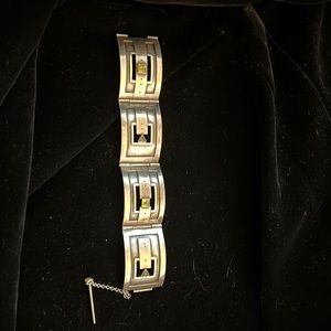 Stunning gold silver bracelet with genuine peridot accents.